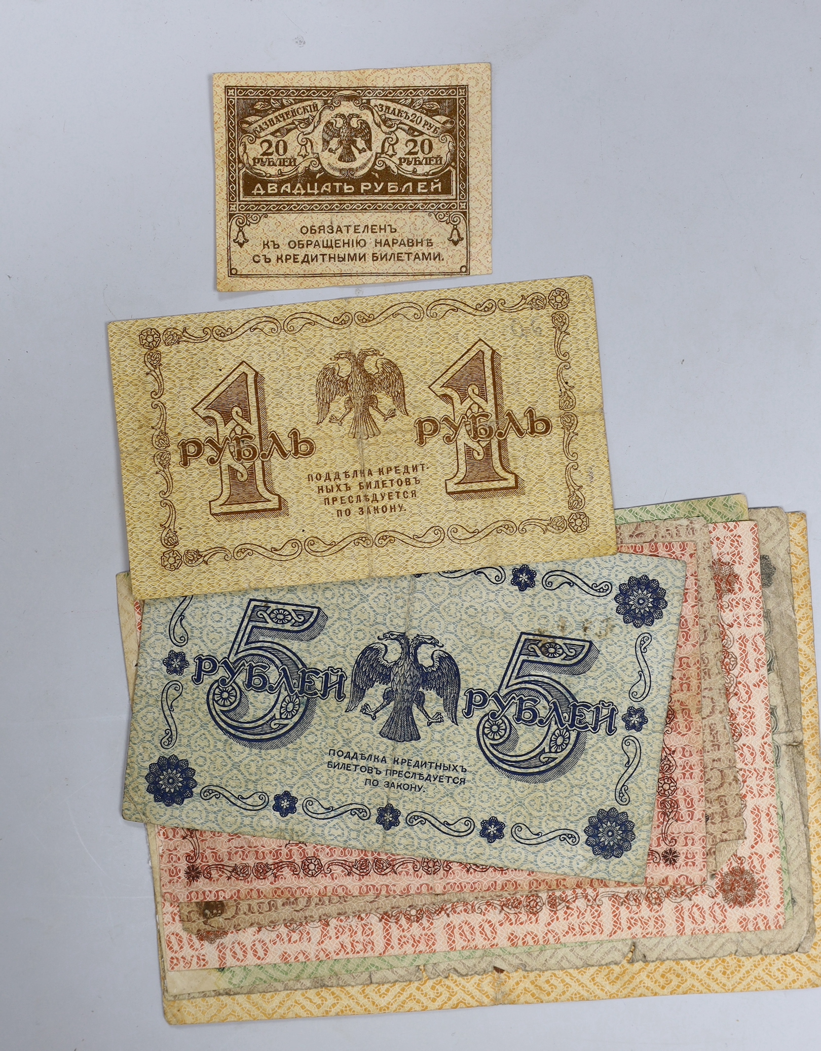 A collection of Russian pre revolutionary banknotes and two Prince Charles Prince of Wales investiture 1969 silver medals